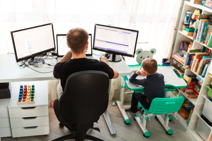 A man and a child using computer