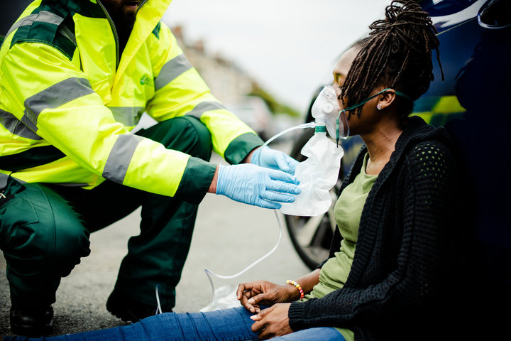 Paramedic cares for an injured woman