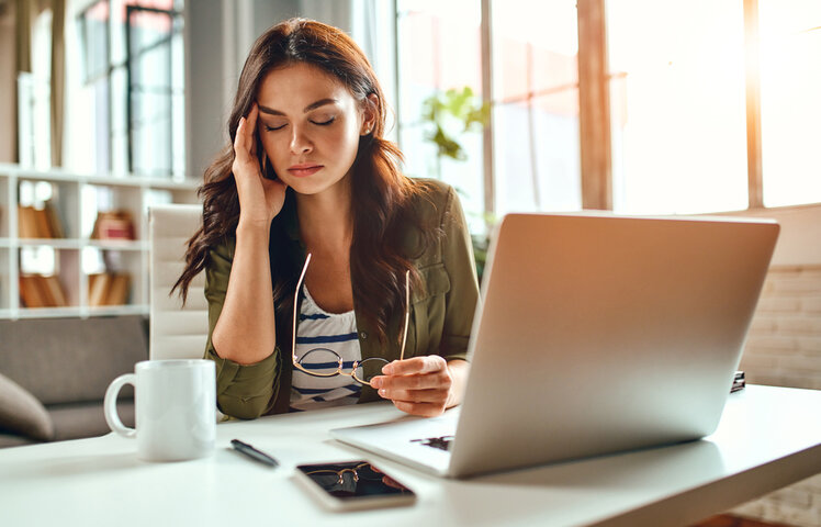 Woman works from home and appears stressed