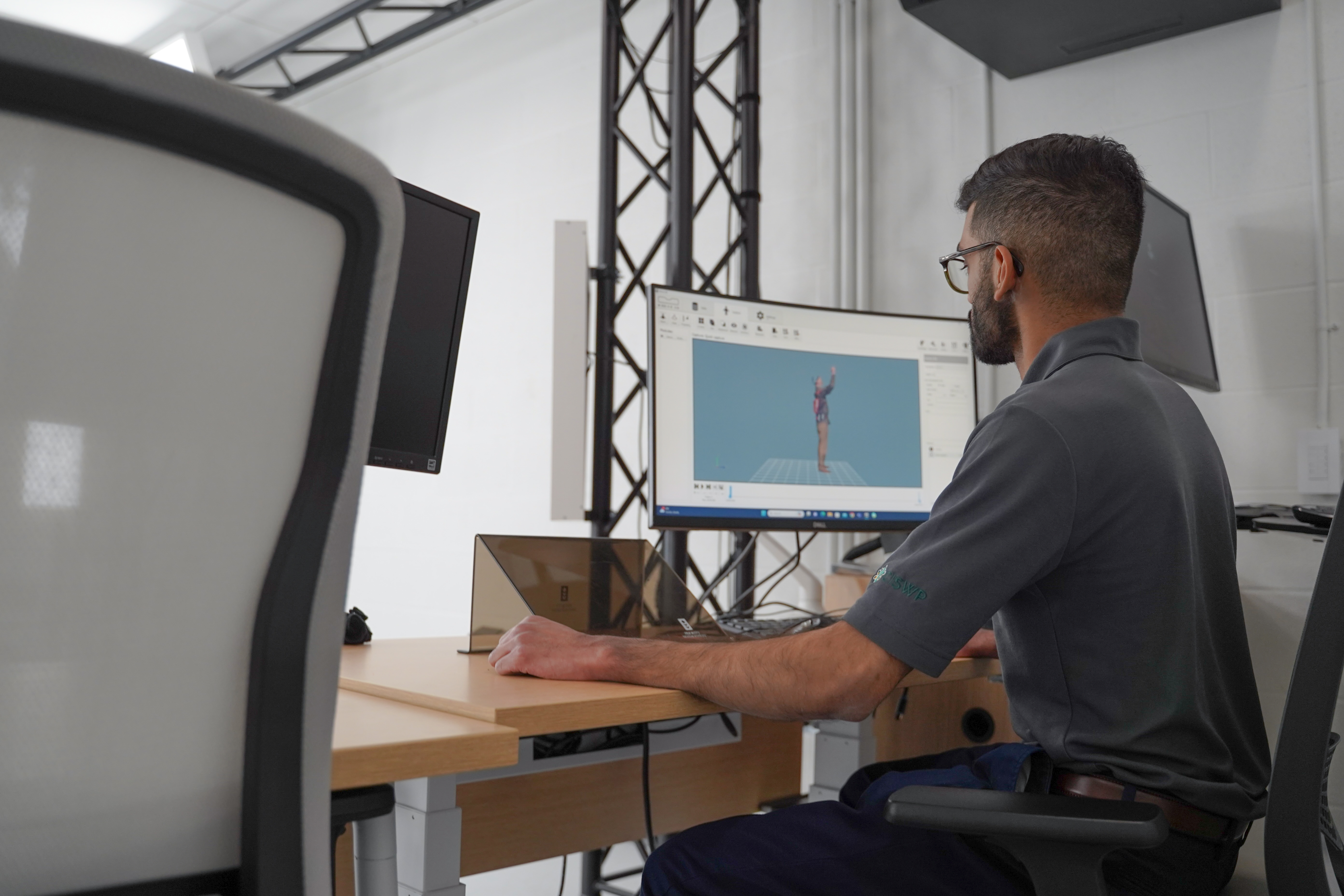 Researcher processing MOVE 4D data on desktop