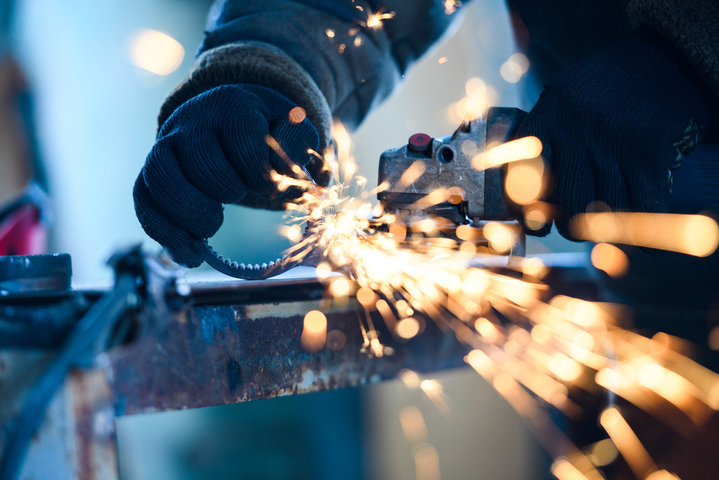 Skilled trades worker wearing PPE in shop
