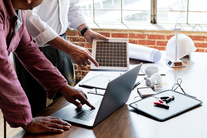 Colleagues working at a busy desk